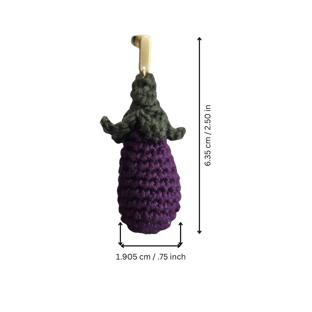 Crocheted purple and green eggplant earrings with measurements on a white background