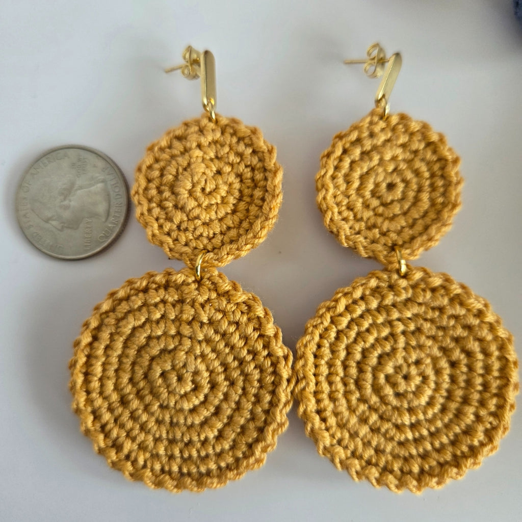 Two round dangling handmade crochet earring in neutral yellow color