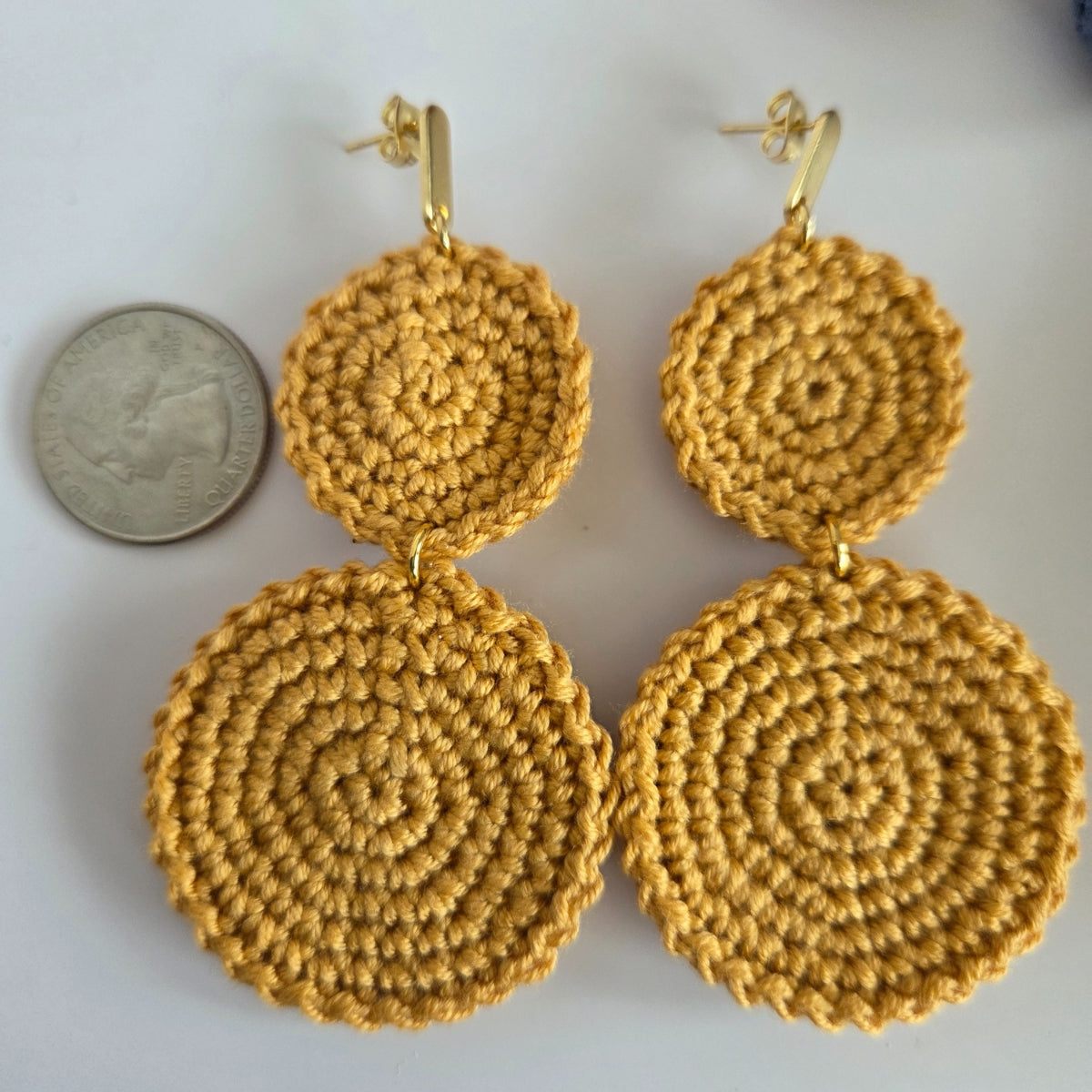Two round dangling handmade crochet earring in neutral yellow color
