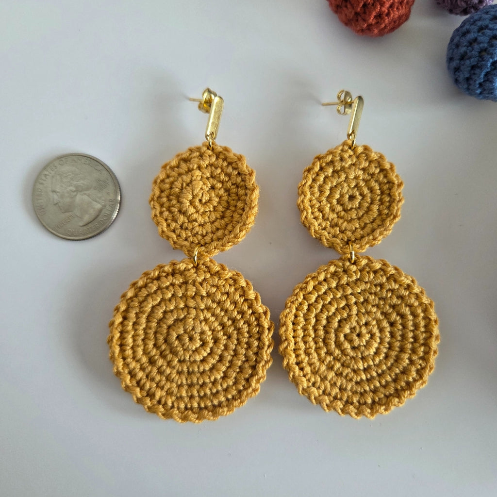 Dangling crochet earring in earth-tone yellow color with gold-plated earring
