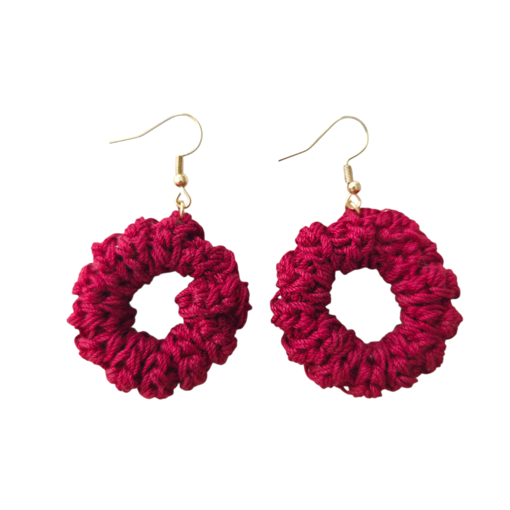 Pair of burgundy crochet earrings on a white background