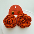 Ginger rose earring in an aliqui & co card on a white background
