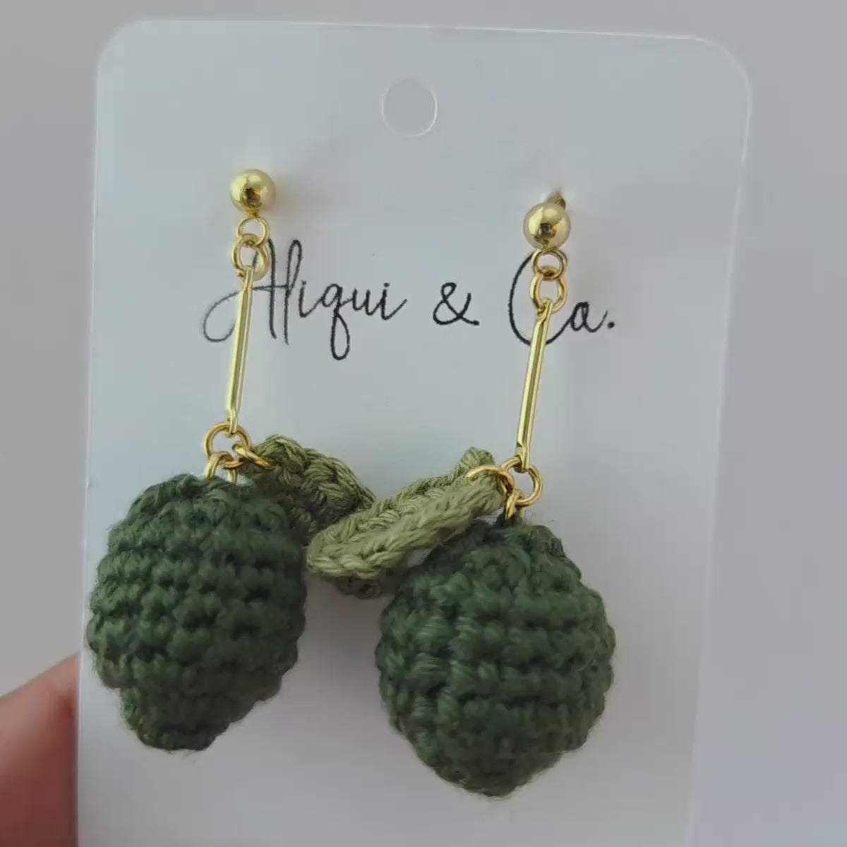 Cute crochet mini lime earrings on a card